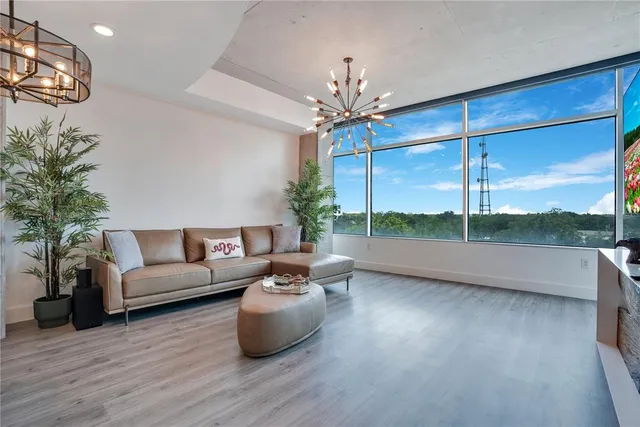 a living room with furniture fireplace and flat screen tv
