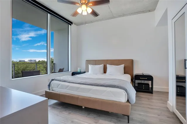 a bedroom with a large bed and a window