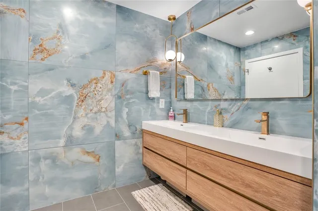a bathroom with a toilet sink and shower