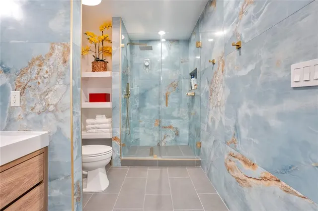 a view of a workspace with furniture and wooden floor