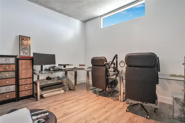 a bedroom with bed and window