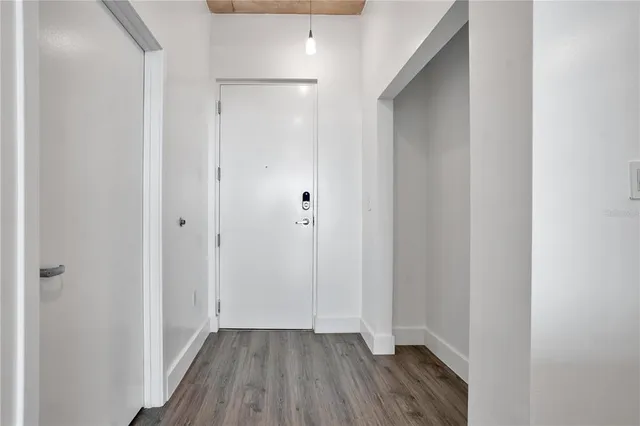 a kitchen with stainless steel appliances kitchen island granite countertop a stove a sink and a refrigerator