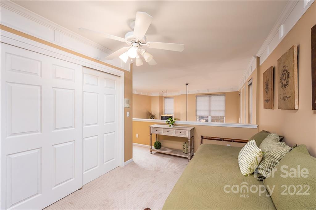 3541 Vandora Springs Road Fort Mill, SC 29708 - Photo 24 of 40 a living room with furniture and a chandelier