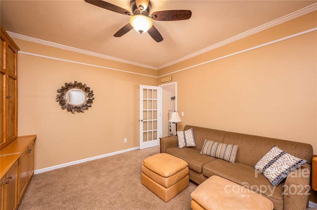 3541 Vandora Springs Road Fort Mill, SC 29708 - Photo 25 of 40 a living room with furniture a ceiling fan and a rug