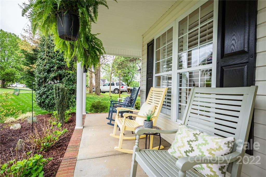 3541 Vandora Springs Road Fort Mill, SC 29708 - Photo 4 of 40 a view of a patio with couches table and chairs and potted plants
