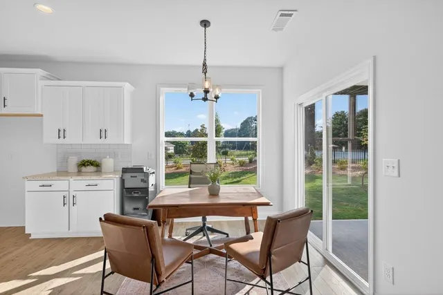 a kitchen with stainless steel appliances granite countertop a sink and stove