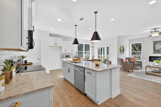 a large white kitchen with lots of counter space