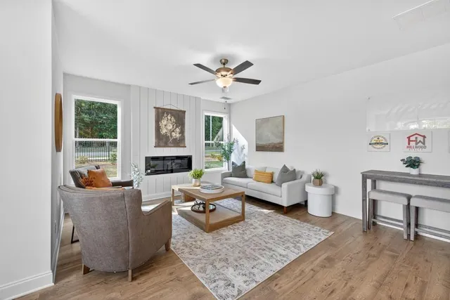 a living room with furniture and a sink