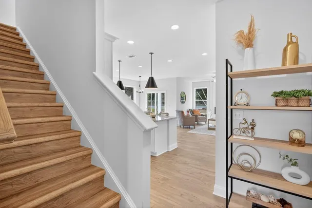 a view of entryway and hall with wooden floor