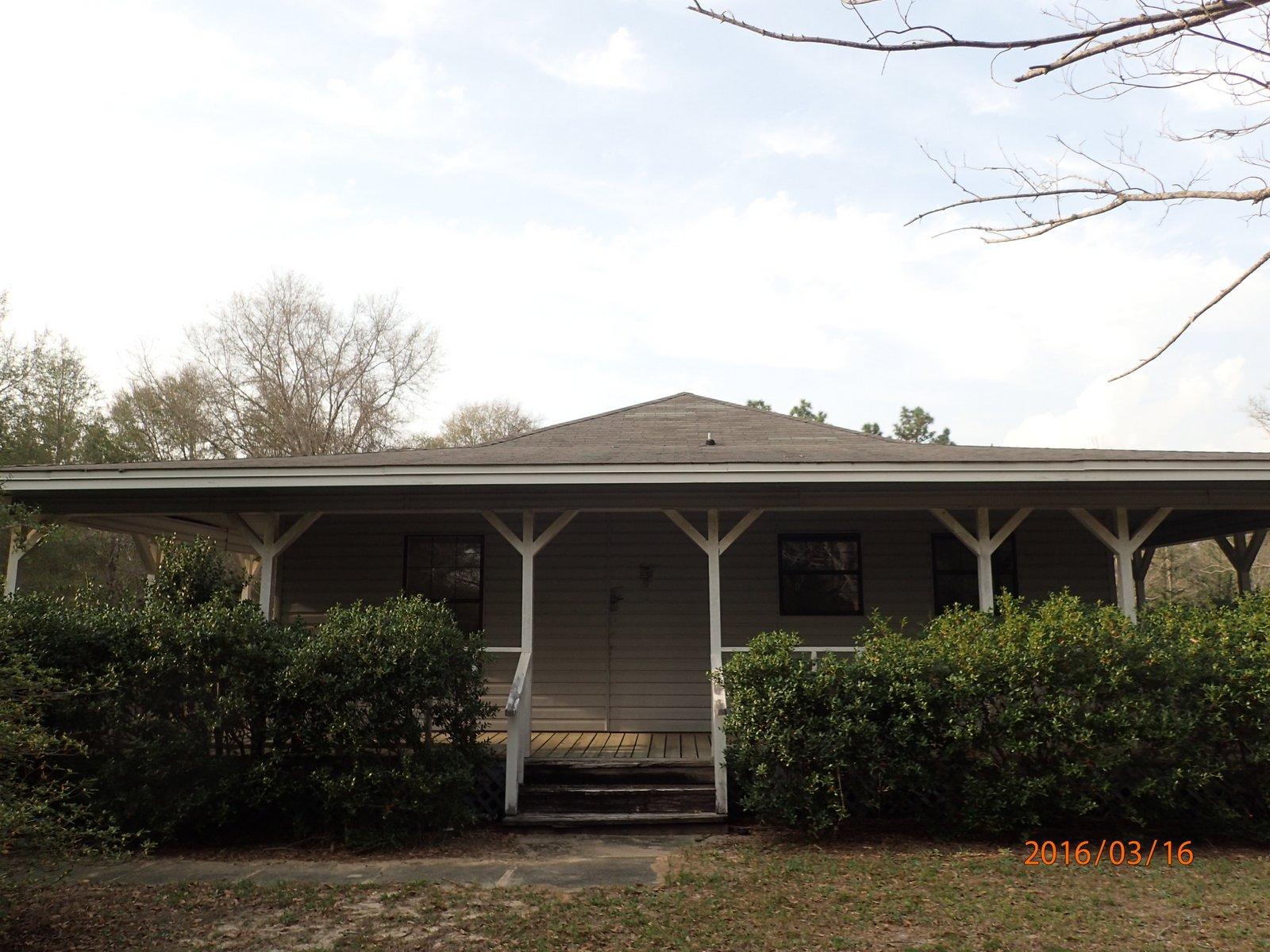 5864 Ward''s Ranch Road Crestview, FL 32536 - Photo 1 of 16 front view of house with potted plants