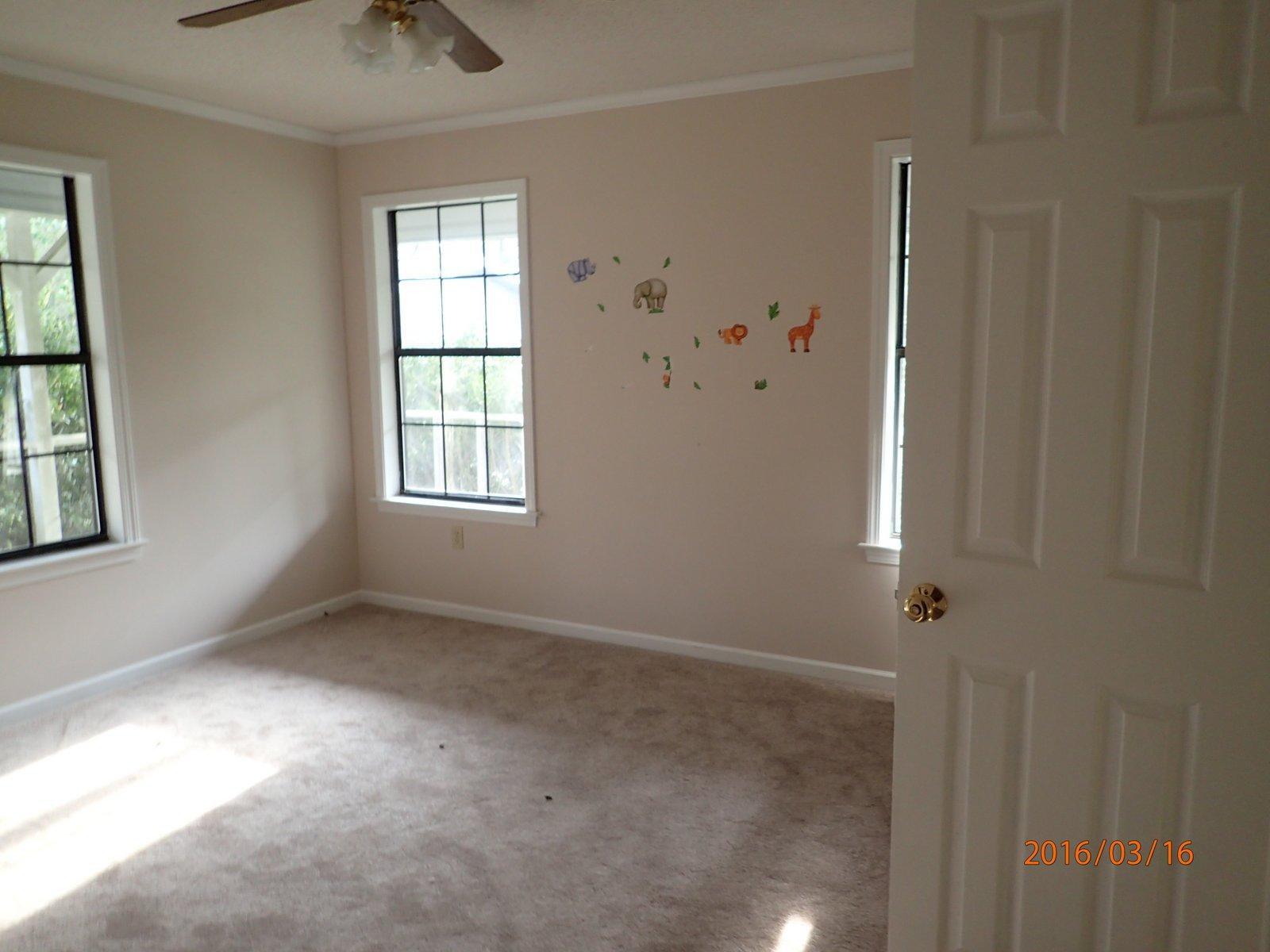 5864 Ward''s Ranch Road Crestview, FL 32536 - Photo 12 of 16 an empty room with windows and closet