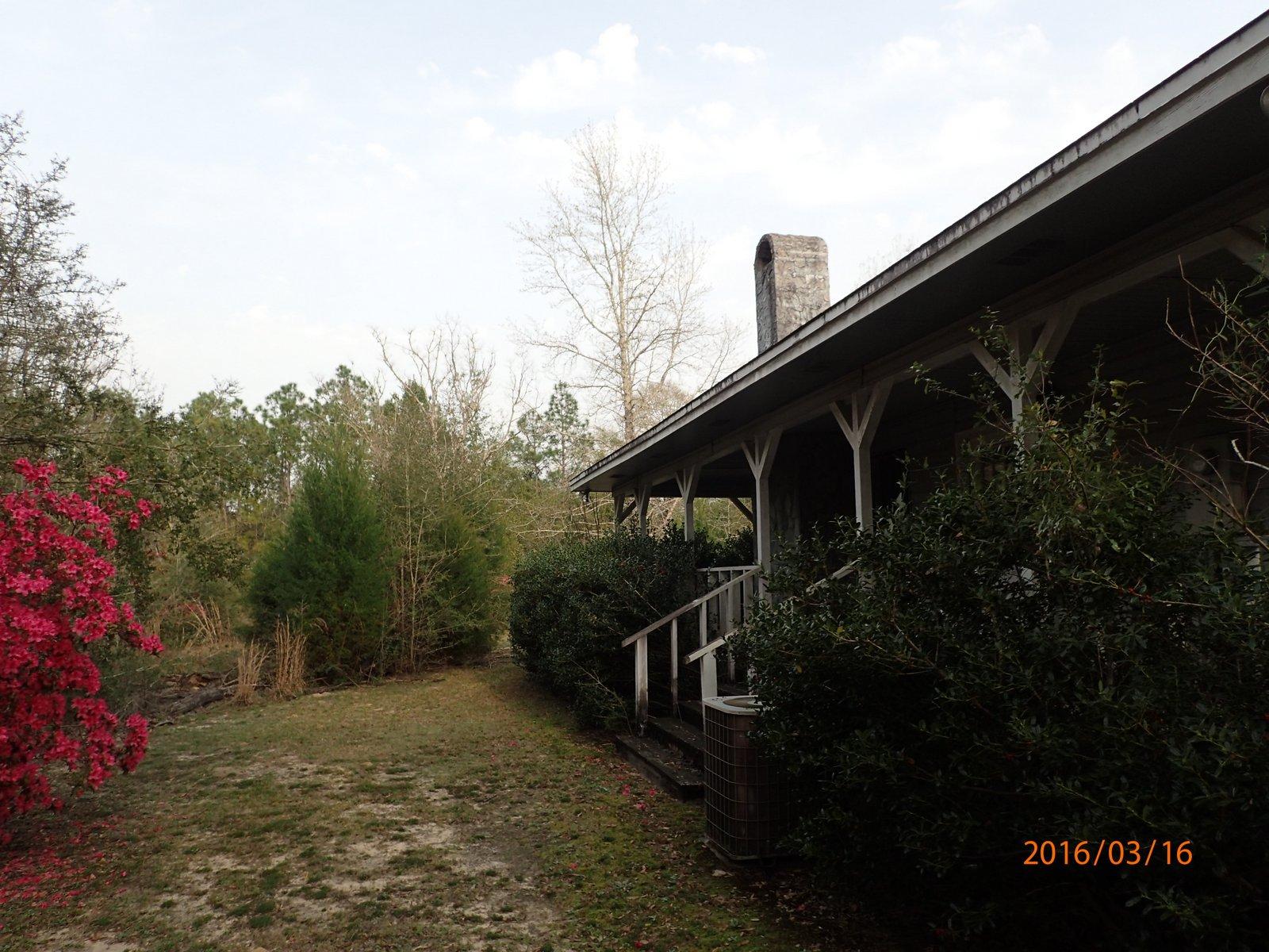 5864 Ward''s Ranch Road Crestview, FL 32536 - Photo 14 of 16 a backyard of a house with lots of green space