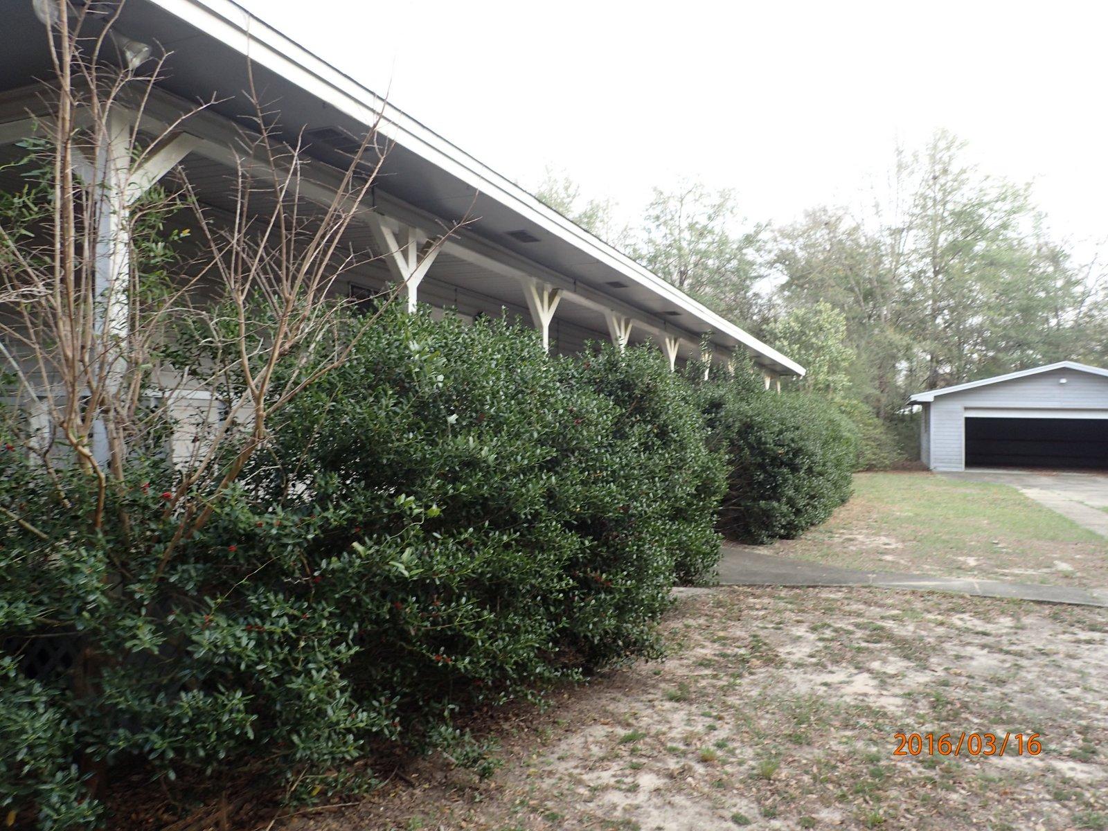 5864 Ward''s Ranch Road Crestview, FL 32536 - Photo 15 of 16 a backyard of a house with lots of green space