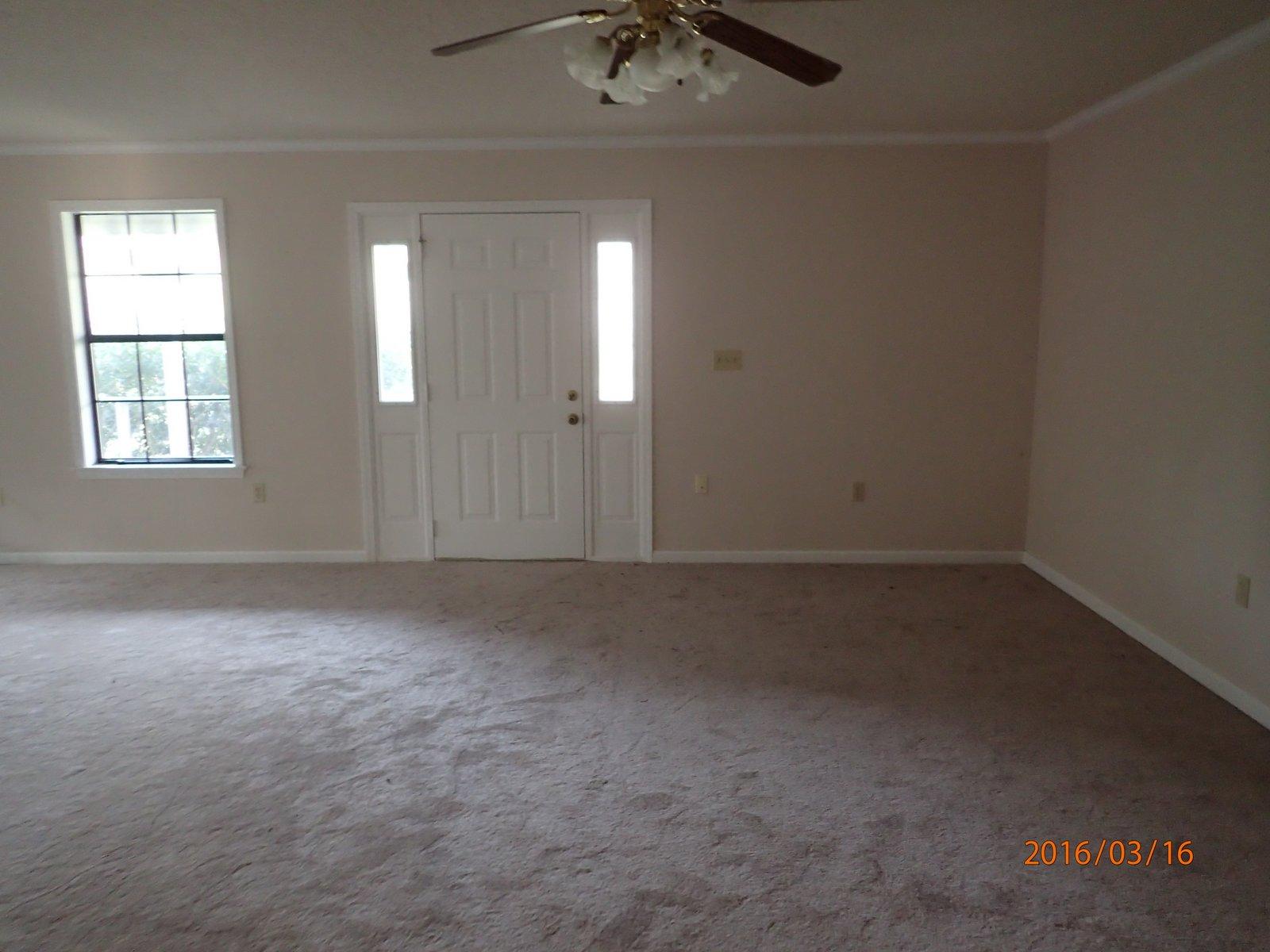 5864 Ward''s Ranch Road Crestview, FL 32536 - Photo 5 of 16 an empty room that has a window in it