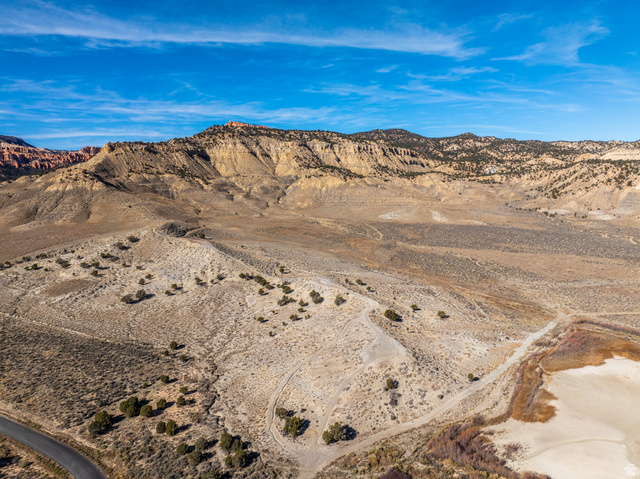 1040 West Under The Rim Road Tropic, UT 84776 - Photo 2 of 21 Expansive desert landscape featuring rugged mountain terrain, natural rock formations, and varied ground cover