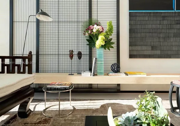 a view of swimming pool with outdoor seating and lake view