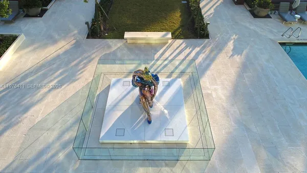 a view of swimming pool with a yard