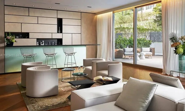 a view of a dining room with furniture and a window