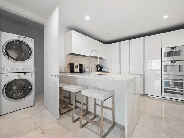 a view of kitchen with sink and cabinets