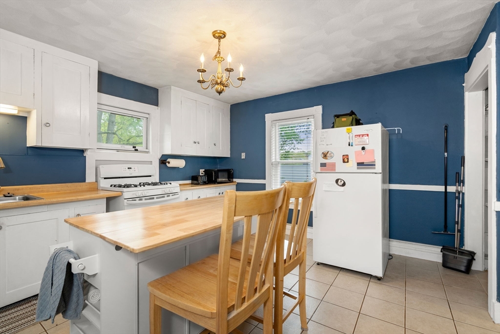 26 Powder Mill Road Maynard, MA 01754 - Photo 3 of 16 a kitchen with stainless steel appliances a refrigerator sink and cabinets