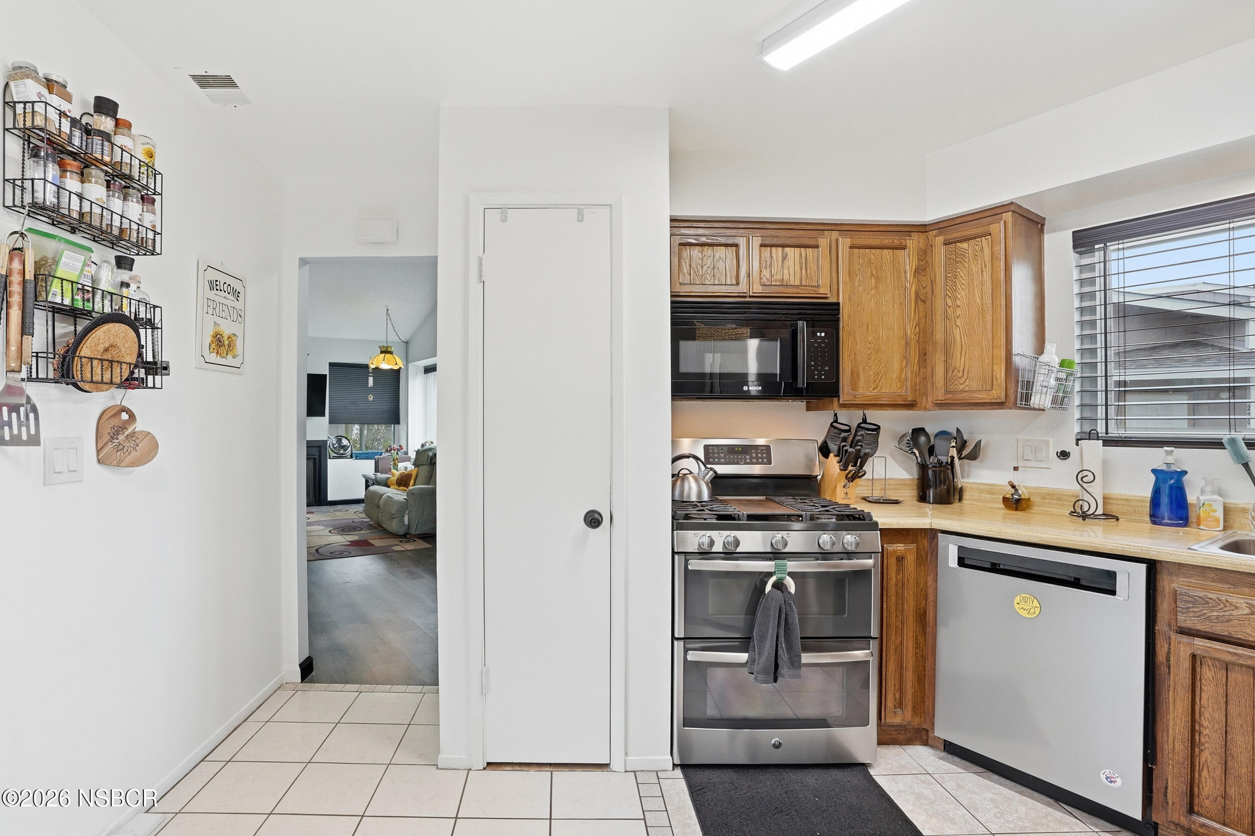 218 North R Street Lompoc, CA 93436 - Photo 15 of 24 a kitchen with a sink a stove and cabinets