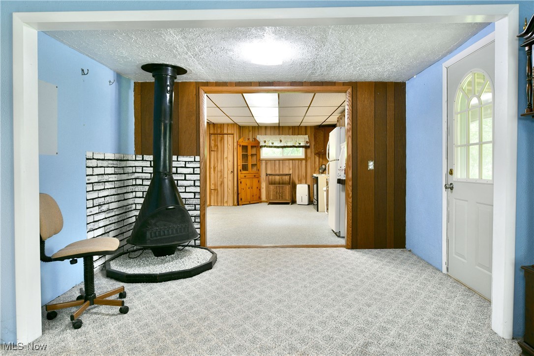 5578 Shaffer Road Northwest Warren, OH 44481 - Photo 19 of 48 Corridor featuring carpet floors and wooden walls