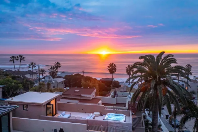 a view of a swimming pool with a table and chairs