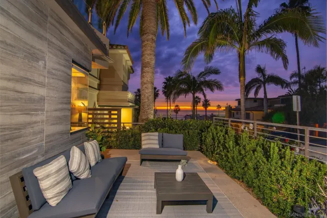 a view of balcony with potted plants and palm trees