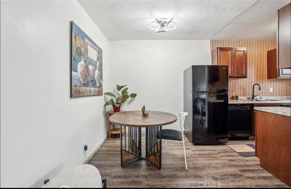 a kitchen with a refrigerator and a sink