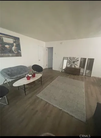 a bedroom with a bed and chair