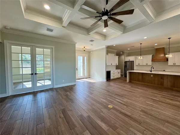 a view of a kitchen with a sink and a window
