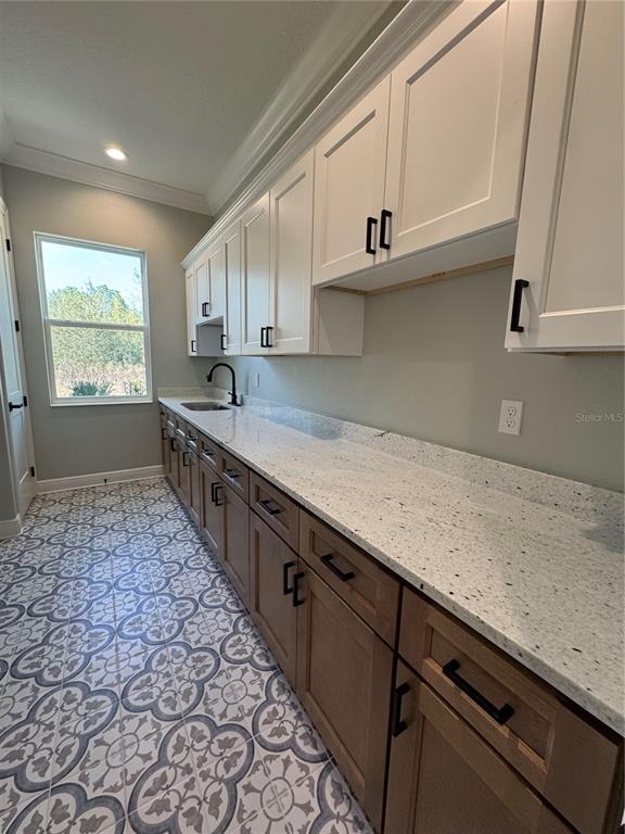 18354 Southwest 65th Loop Dunnellon, FL 34432 - Photo 15 of 35 a kitchen with stainless steel appliances granite countertop a sink a stove and a microwave