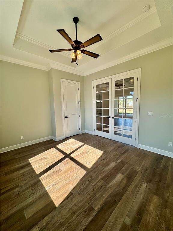 18354 Southwest 65th Loop Dunnellon, FL 34432 - Photo 18 of 35 a view of a room with wooden floor and a ceiling fan