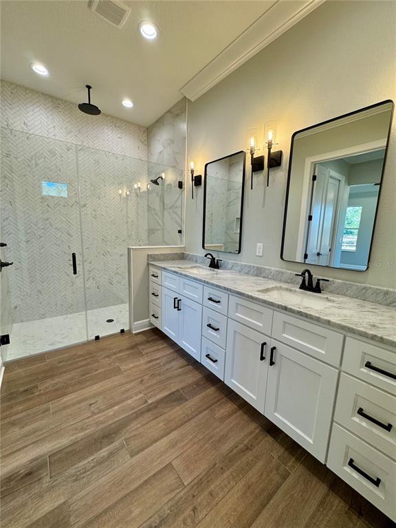 18354 Southwest 65th Loop Dunnellon, FL 34432 - Photo 23 of 35 a spacious bathroom with double sink and a large mirror