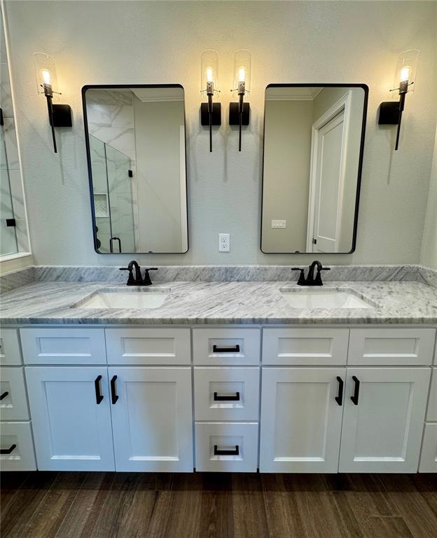 18354 Southwest 65th Loop Dunnellon, FL 34432 - Photo 24 of 35 a bathroom with double vanity sink and mirror