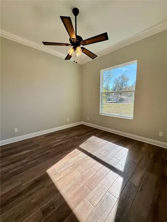 a view of a big room with wooden floor and closet