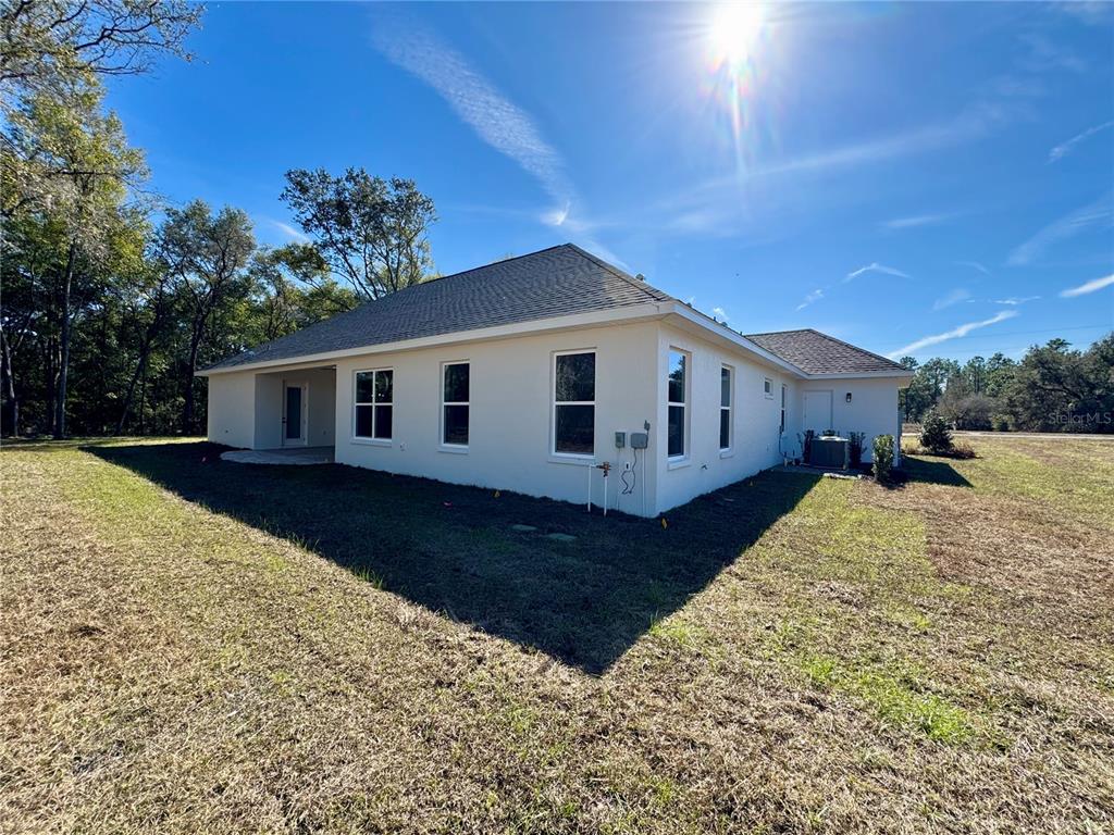 18354 Southwest 65th Loop Dunnellon, FL 34432 - Photo 34 of 35 a view of a house with a yard