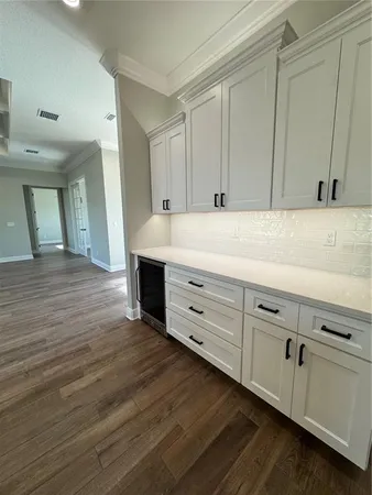 a view of kitchen with cabinets