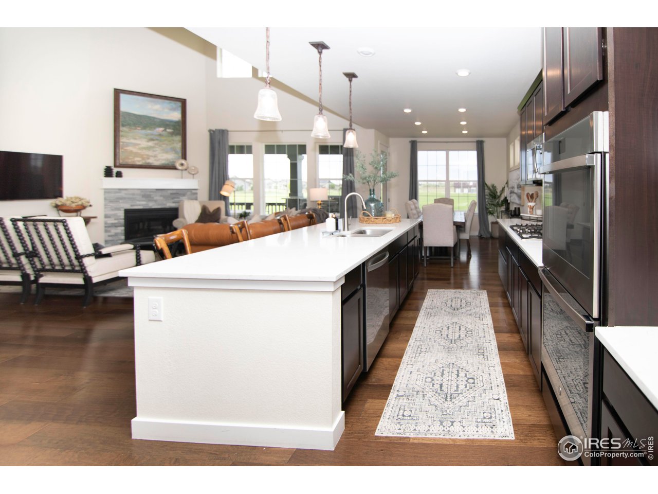 7086 Thunderview Drive Timnath, CO 80547 - Photo 13 of 38 a open kitchen with sink stove and refrigerator