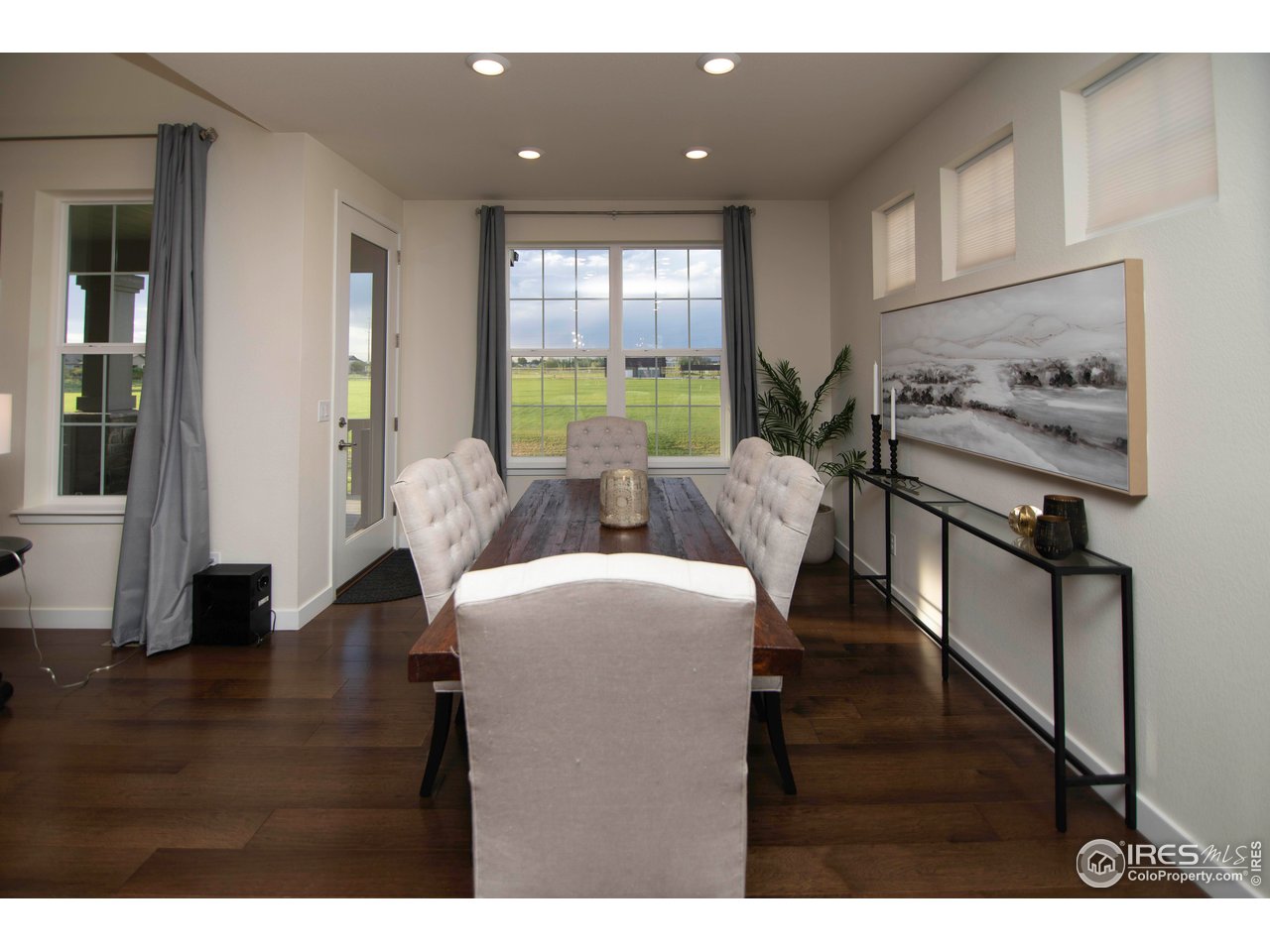 7086 Thunderview Drive Timnath, CO 80547 - Photo 18 of 38 a living room with furniture and a large window