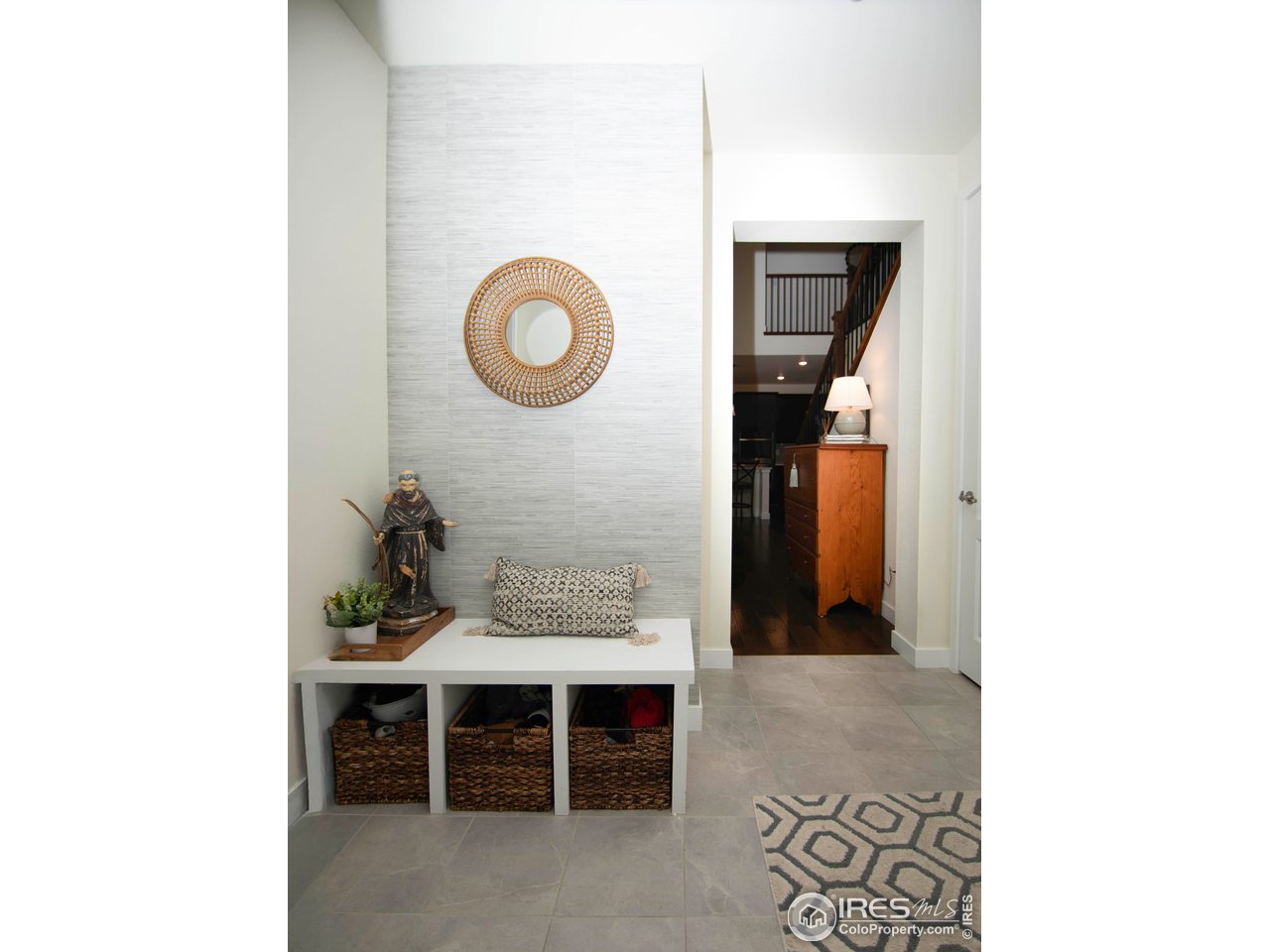 7086 Thunderview Drive Timnath, CO 80547 - Photo 19 of 38 a view of a room with a bench and cabinets