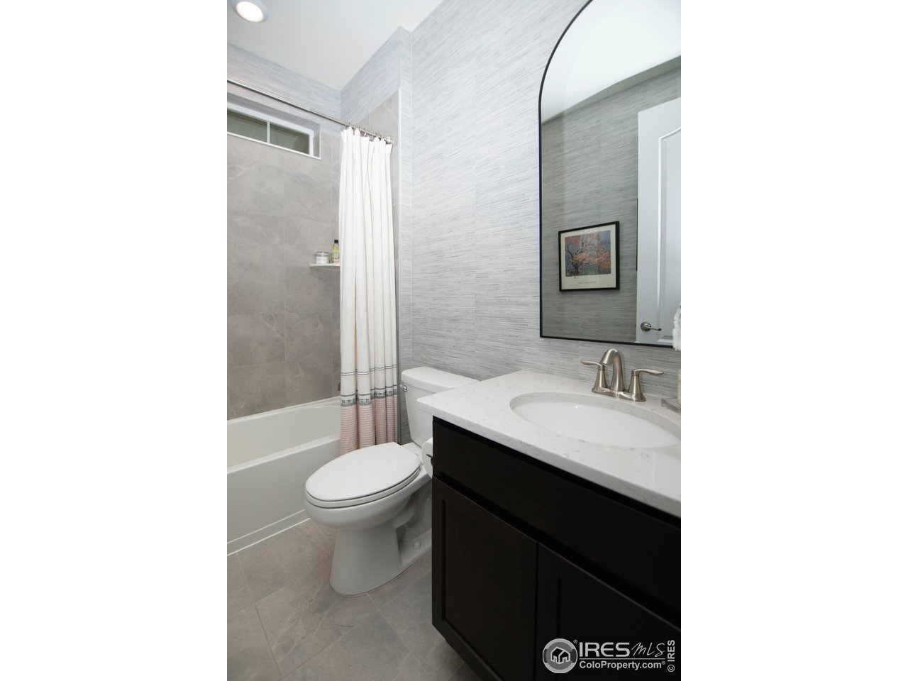 7086 Thunderview Drive Timnath, CO 80547 - Photo 20 of 38 a bathroom with a sink and a toilet