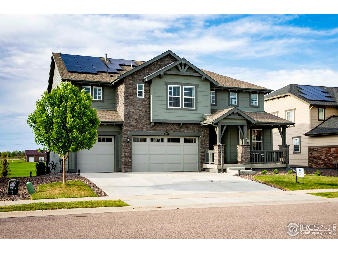 7086 Thunderview Drive Timnath, CO 80547 - Photo 2 of 38 a view of a house with a swimming pool