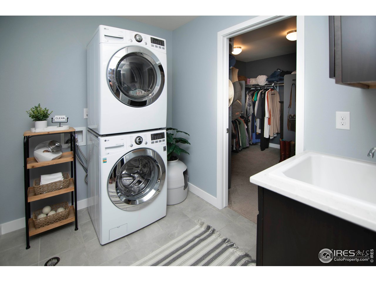 7086 Thunderview Drive Timnath, CO 80547 - Photo 24 of 38 a utility room with sink dryer and washer