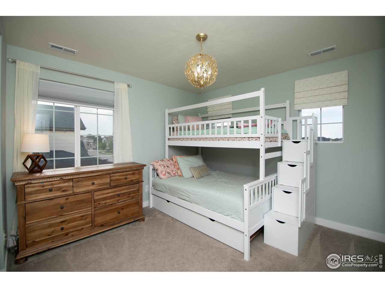 7086 Thunderview Drive Timnath, CO 80547 - Photo 26 of 38 a view of living room with furniture and a chandelier