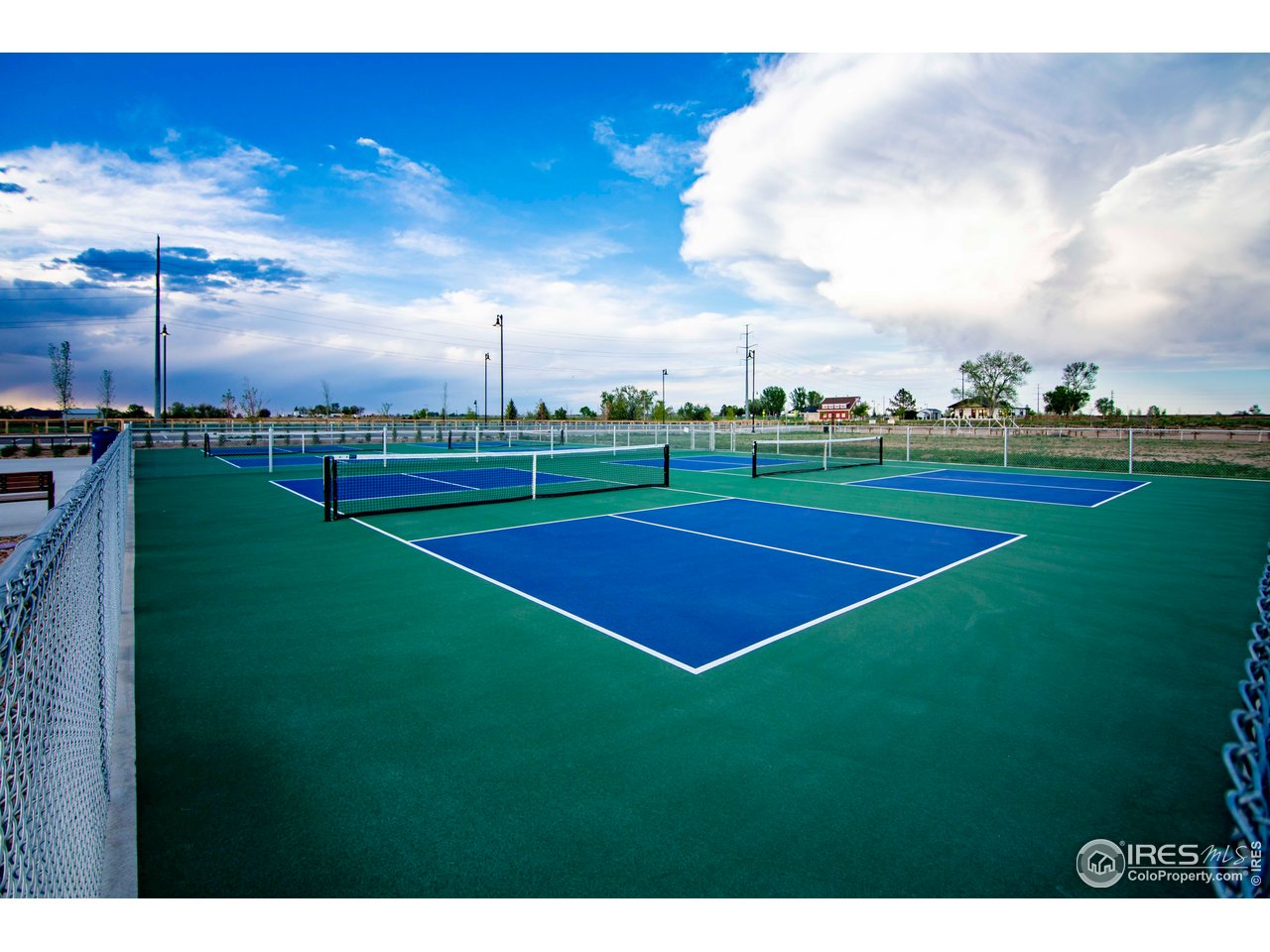 7086 Thunderview Drive Timnath, CO 80547 - Photo 31 of 38 a view of a green field and trees