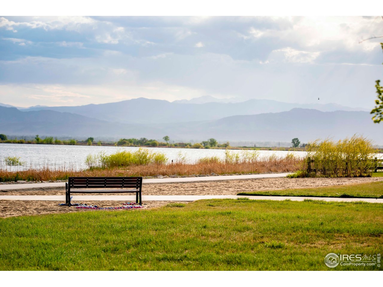 7086 Thunderview Drive Timnath, CO 80547 - Photo 37 of 38 a view of a lake with a city