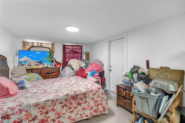 a bedroom with two beds and a couch