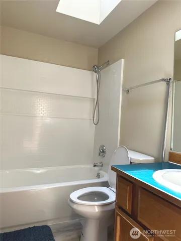 a bathroom with a sink a toilet and a bathtub