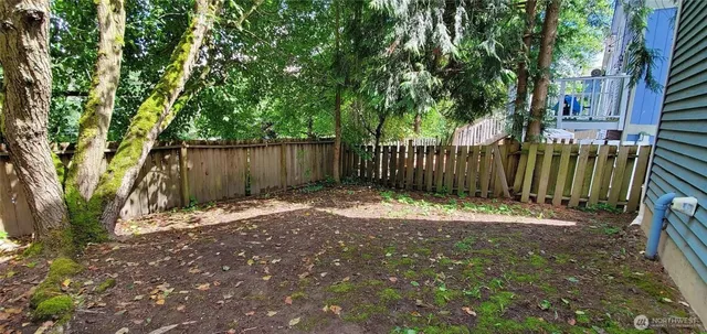 a view of outdoor space with wooden fence